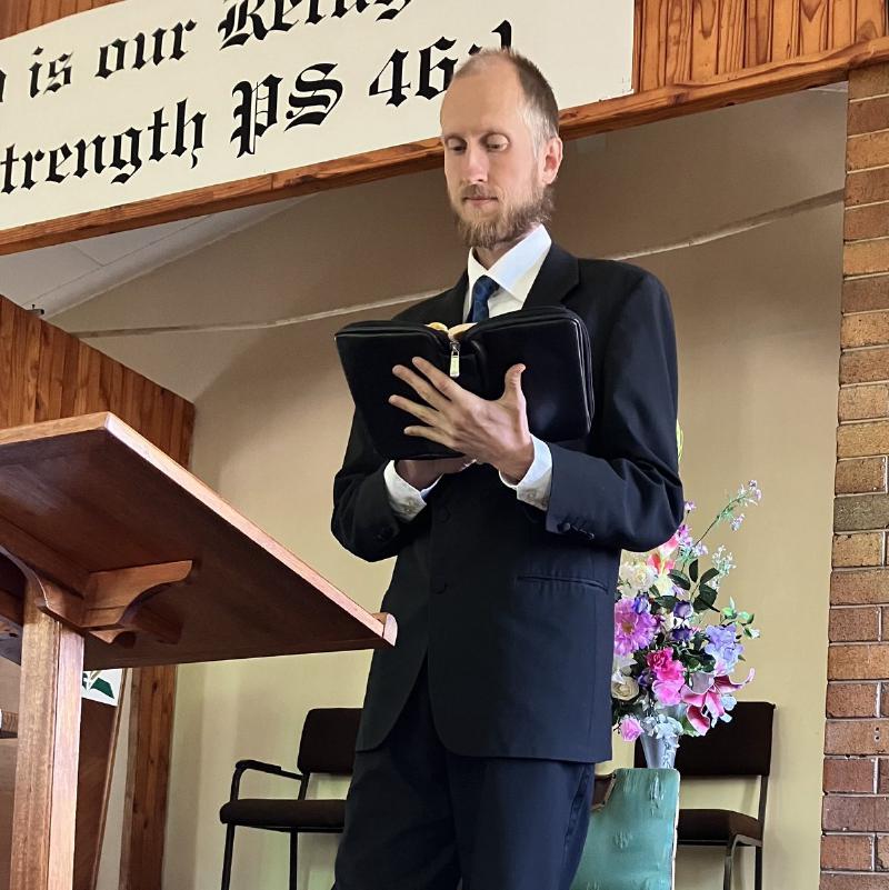 Daniel Gustafsson preaching from the Bible